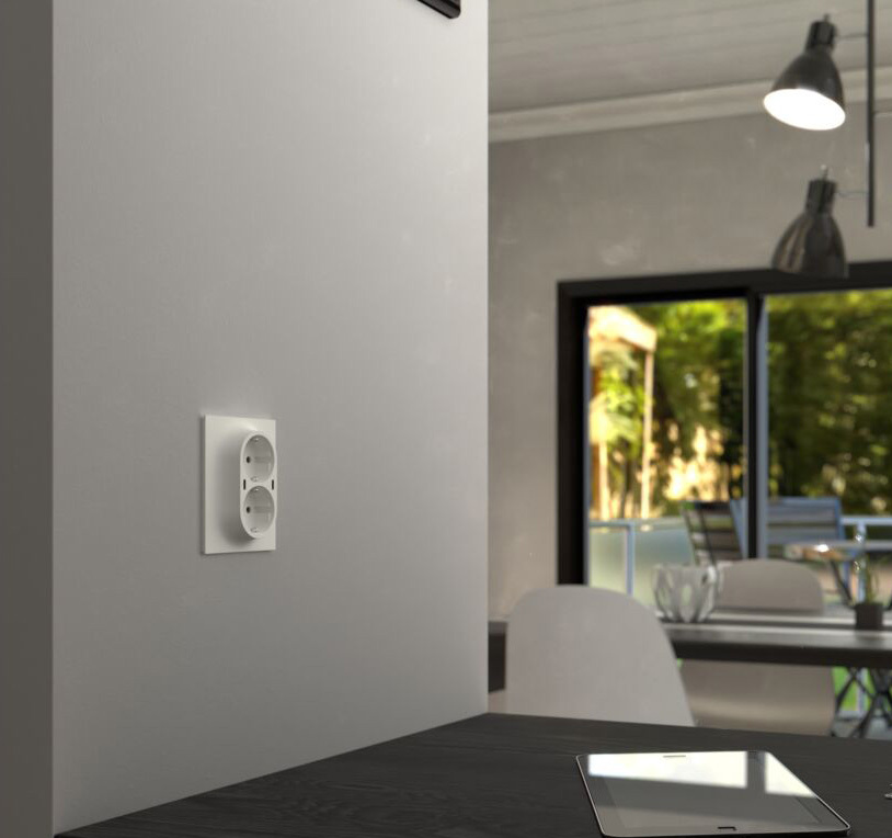 Bildet viser en stikkontakt på vegg. Foto.